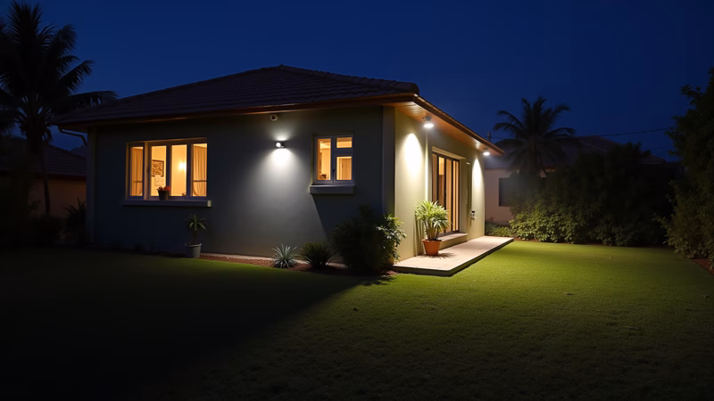 House at night, motion sensor lights, illuminated garden, security, Brazilian architecture, Iluminação noturna com sensor de movimento para segurança.