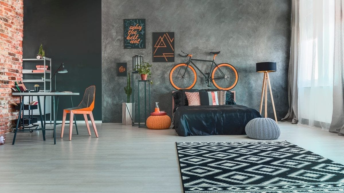 Sala de Estar Industrial com Cimento Queimado, Metal e Tubulações à Vista - detalhe