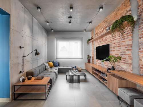 Sala de Estar Industrial com Cimento Queimado, Metal e Tubulações à Vista - ideia