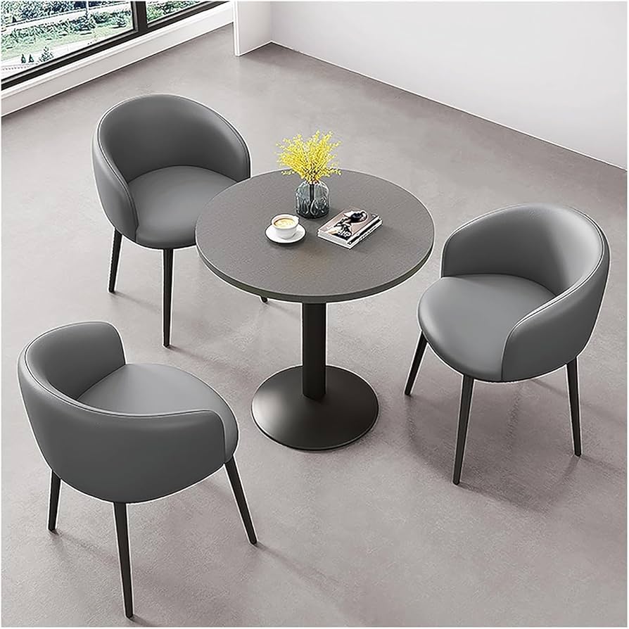 Mesa Redonda com Base de Metal e Cadeiras Coloridas: Design Vibrante e Aconchegante - ideia