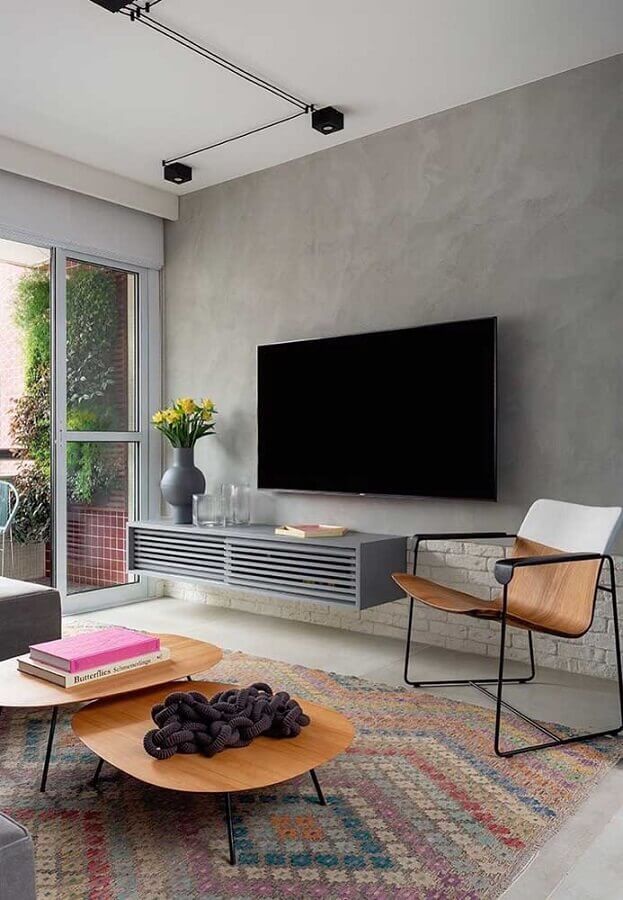 Parede de Cimento Queimado com Iluminação Estratégica: Valorizando a Textura - inspiração